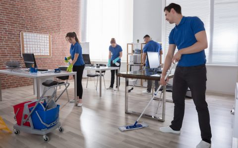 Janitors Cleaning The Office